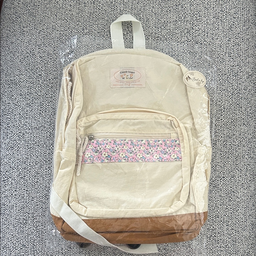 Cream and Tan Backpack with Floral Accent